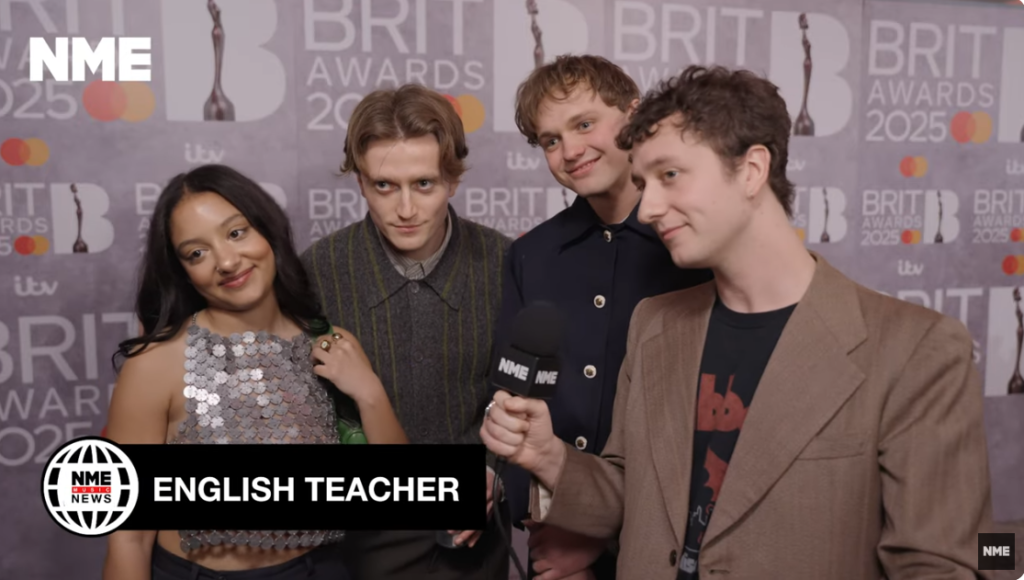 English Teacher photographed in an interview with NME at the 2025 BRIT Awards. 