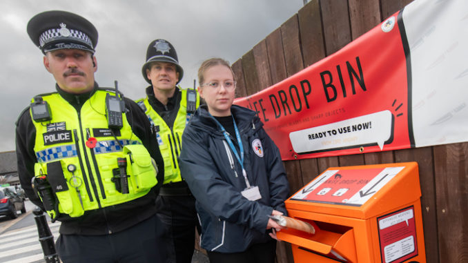 North Yorkshire Council community safety officer, Evie Griffiths, with North Yorkshire Police officers, PCs Kelvin Troughton and Brendon Frith, at the launch of the county's first knife drop bin in Harrogate in 2023