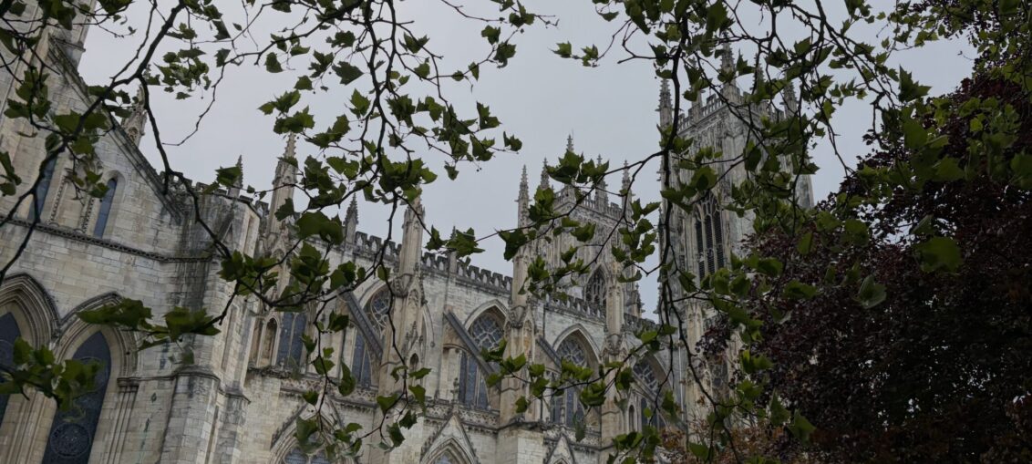 Shows the York Minster, this is the main attraction for visitors. Locals appreciate its purpose and beauty every day. The picture allows people to instantly know what city the article is talking about.