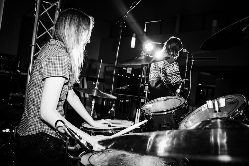 Black and White image of Wednesday Flowers's drummer playing at Jukebox Festival 