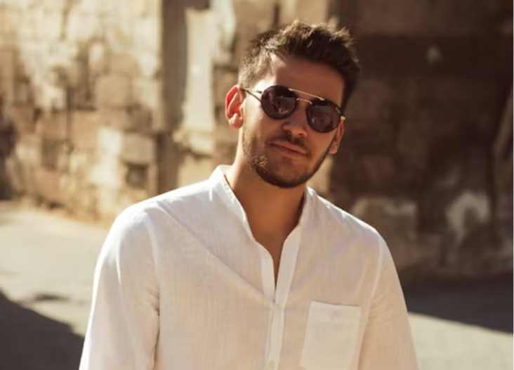 unsplash licensed Batuhan Dogan. man in white linen shirt.